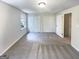 Spacious bedroom with neutral walls, carpet, and dual closets at 4405 Cary Dr, Snellville, GA 30039