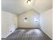 Bright bedroom with neutral walls, plush carpet, and a vaulted ceiling at 4405 Cary Dr, Snellville, GA 30039