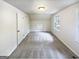 Bedroom with neutral walls, carpet, large window, and ample closet space at 4405 Cary Dr, Snellville, GA 30039