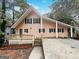 Charming A-frame home with a spacious deck, black shutters, and inviting curb appeal at 4405 Cary Dr, Snellville, GA 30039