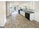 Bright kitchen featuring white cabinets, dark appliances, and plenty of space for cooking at 4405 Cary Dr, Snellville, GA 30039