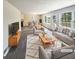 Inviting living area with hardwood floors, neutral paint, a cozy fireplace, and an abundance of natural light at 4405 Cary Dr, Snellville, GA 30039