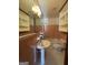 Retro bathroom featuring tiled walls, pedestal sink, and classic fixtures at 1511 Walker Ave, College Park, GA 30337