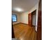 Bedroom with hardwood floors, natural light, and a closet, creating a cozy and functional space at 1511 Walker Ave, College Park, GA 30337