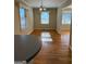Inviting dining area with hardwood flooring and natural light; open layout for easy flow at 1511 Walker Ave, College Park, GA 30337