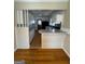 Functional kitchen with ample counter space and white cabinetry, looking out to the breakfast area at 1511 Walker Ave, College Park, GA 30337