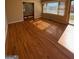 Inviting living room with gleaming hardwood floors and sun-drenched bay window at 1511 Walker Ave, College Park, GA 30337