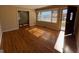 Inviting living room with gleaming hardwood floors and sun-drenched bay window at 1511 Walker Ave, College Park, GA 30337