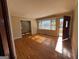 Inviting living room with gleaming hardwood floors and sun-drenched bay window at 1511 Walker Ave, College Park, GA 30337
