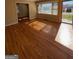 Inviting living room with gleaming hardwood floors and sun-drenched bay window at 1511 Walker Ave, College Park, GA 30337