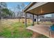 Expansive backyard featuring a covered patio, gazebo, and plenty of green space for outdoor activities at 1406 Stone Ridge Ct, Hampton, GA 30228