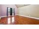 The room is decorated with a vibrant color scheme, hardwood floors, and large windows at 1406 Stone Ridge Ct, Hampton, GA 30228