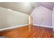 Spacious bedroom with vaulted ceilings, hardwood floors, and ample natural light streaming through the windows at 1406 Stone Ridge Ct, Hampton, GA 30228