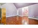 Bright bedroom with hardwood floors, vaulted ceilings, and neutral color palette, ready for personalization at 1406 Stone Ridge Ct, Hampton, GA 30228