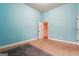 Bedroom with blue walls, plush carpet, and white trim at 1406 Stone Ridge Ct, Hampton, GA 30228