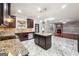 Kitchen with granite countertops, stainless steel appliances, tile backsplash, and marble floors at 1406 Stone Ridge Ct, Hampton, GA 30228