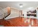 Spacious living room with hardwood flooring leading to the kitchen at 1406 Stone Ridge Ct, Hampton, GA 30228