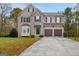 Two-story brick home with a two-car garage and basketball court at 6358 Stoneview Sw Ln, South Fulton, GA 30331