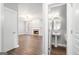 Well-lit bathroom featuring a pedestal sink and tile floors, situated near an adjacent living space at 1714 Boulder Walk Se Ln, Atlanta, GA 30316