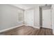 Bright bedroom with two white doors, a window and neutral paint at 1714 Boulder Walk Se Ln, Atlanta, GA 30316