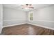 Cozy bedroom with ceiling fan, fresh paint and natural light from the window at 1714 Boulder Walk Se Ln, Atlanta, GA 30316