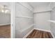 Walk-in closet with wood floor and white wire shelving, providing ample storage space at 1714 Boulder Walk Se Ln, Atlanta, GA 30316