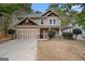 Charming two-story home featuring a front porch, a two-car garage, and tasteful exterior finishes at 1714 Boulder Walk Se Ln, Atlanta, GA 30316
