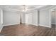 Spacious main bedroom with hardwood floors, a tray ceiling, and ensuite bathroom access at 1714 Boulder Walk Se Ln, Atlanta, GA 30316
