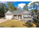 Ranch style home with gray siding, stone accents, and landscaping at 460 Carrie Kathleen Ter, Carrollton, GA 30116