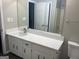 Updated bathroom with quartz countertop, new vanity, and modern fixtures at 11684 Heritage Dr, Hampton, GA 30228