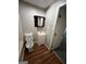 Clean bathroom with a toilet, bathtub, and vanity with a mirror at 11684 Heritage Dr, Hampton, GA 30228