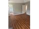 Large bedroom with access to two additional rooms and laminate flooring at 11684 Heritage Dr, Hampton, GA 30228