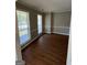 Spacious dining room with hardwood floors and large windows at 11684 Heritage Dr, Hampton, GA 30228