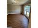 Dining room features hardwood floors and neutral wall colors at 11684 Heritage Dr, Hampton, GA 30228