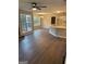Bright dining room with laminate flooring and kitchen view at 11684 Heritage Dr, Hampton, GA 30228