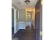 Inviting entryway with dark laminate flooring and neutral walls at 11684 Heritage Dr, Hampton, GA 30228