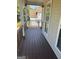 Charming front porch with wooden railing and flooring at 11684 Heritage Dr, Hampton, GA 30228