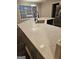 Modern kitchen with stainless steel appliances and white cabinets at 11684 Heritage Dr, Hampton, GA 30228