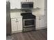 Modern kitchen featuring stainless steel appliances and white cabinetry at 11684 Heritage Dr, Hampton, GA 30228