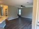 Open living room with stairs and kitchen views at 11684 Heritage Dr, Hampton, GA 30228
