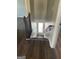 Stylish staircase with dark wood railing leading to the upper level at 11684 Heritage Dr, Hampton, GA 30228