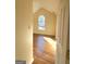 Bedroom featuring vaulted ceiling, hardwood floors and an arched window at 4284 Caroline Ct, Douglasville, GA 30135
