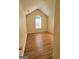 Bedroom boasts vaulted ceiling, hardwood floors and arched window at 4284 Caroline Ct, Douglasville, GA 30135