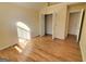 Bedroom features hardwood floors, closet, and window with natural light at 4284 Caroline Ct, Douglasville, GA 30135