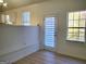 View of a sunlit dining area with windows and views to the outside at 4284 Caroline Ct, Douglasville, GA 30135