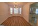 Bright dining room featuring a chandelier, wainscoting and windows with natural light at 4284 Caroline Ct, Douglasville, GA 30135