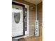 Close up of the front door with sidelight, welcome sign, and freshly painted trim at 4284 Caroline Ct, Douglasville, GA 30135