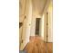Hallway features hardwood flooring, neutral walls, and white trim and doors at 4284 Caroline Ct, Douglasville, GA 30135