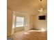 Spacious living room with vaulted ceilings, hardwood floors, modern lighting, and large windows at 4284 Caroline Ct, Douglasville, GA 30135