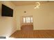 Bright living room with modern light fixture, hardwood floors, and an open floor plan at 4284 Caroline Ct, Douglasville, GA 30135
